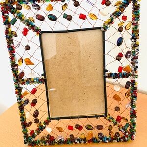 Beaded copper wire picture frame.